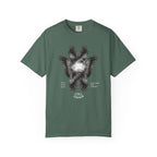 Green t-shirt with text 'Powered by caffeine & band rehearsals' on a white background