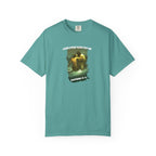 Teal t-shirt with graphic design and text on a white background