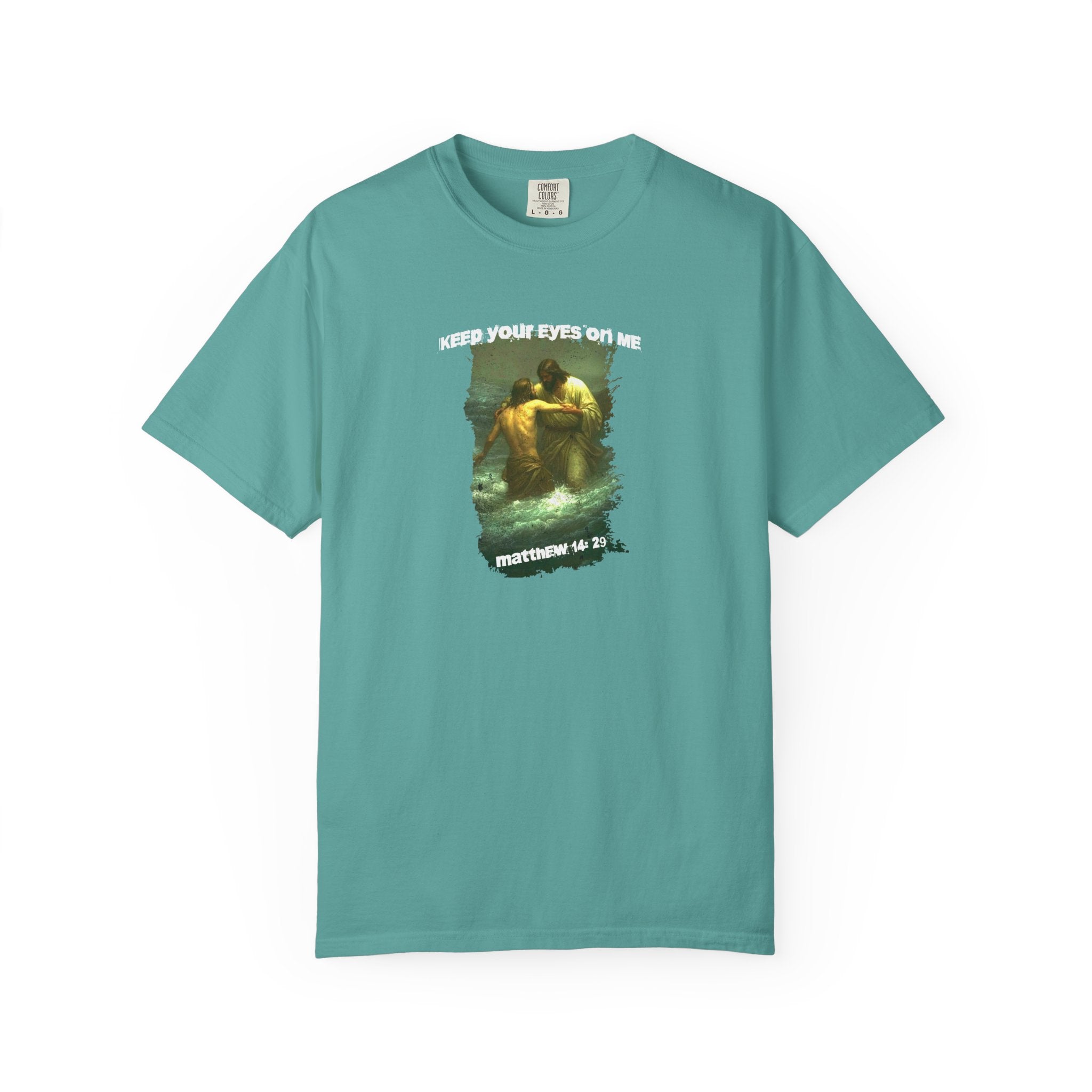 Teal t-shirt with graphic design and text on a white background