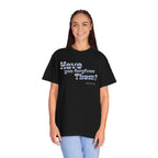 Person wearing a black t-shirt with text on a white background