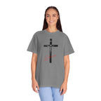 Person wearing a gray t-shirt with a cross design on a white background