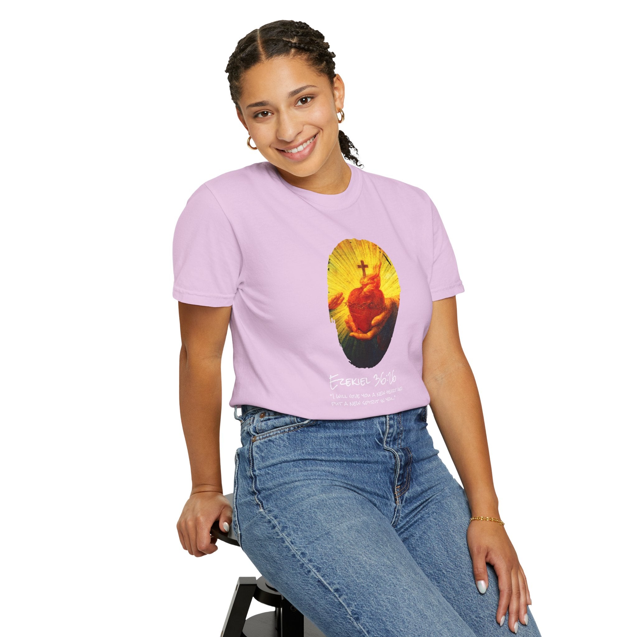 Person wearing a purple t-shirt with a graphic design on a white background