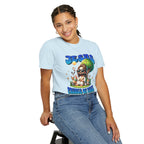 Person wearing a light blue t-shirt with a colorful graphic design on a white background