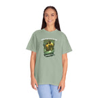 Person wearing a green t-shirt with a graphic design and text on a white background