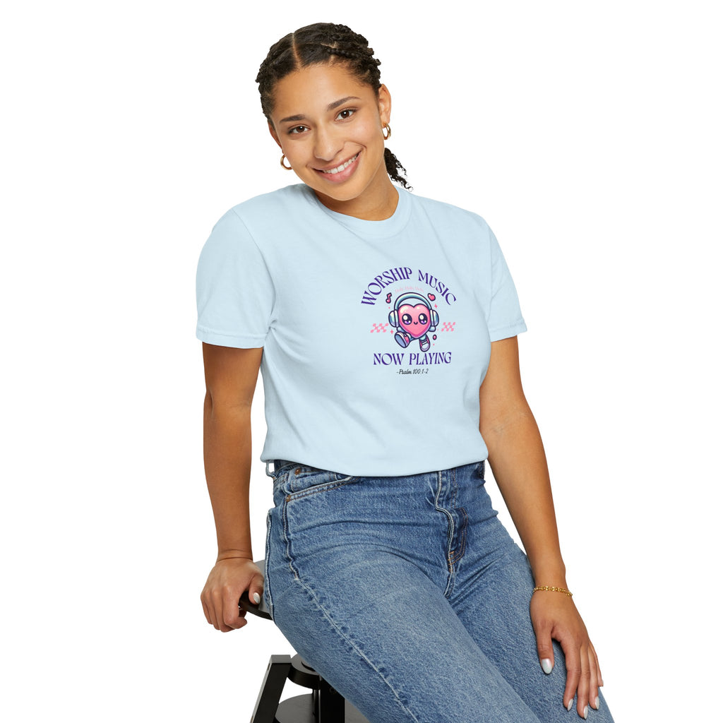 Person wearing a light blue t-shirt with a graphic design on a white background