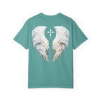 Teal t-shirt with white angel wings design on a white background