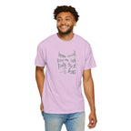 Man wearing a purple t-shirt with text and a cross graphic on a white background