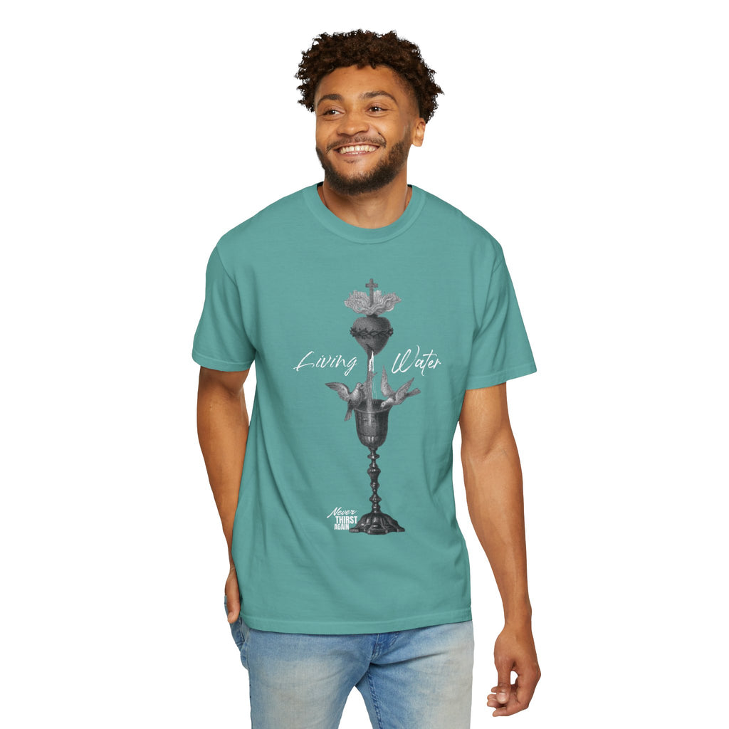 Man wearing a teal t-shirt with a graphic design on a white background