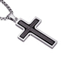 Silver cross pendant with engraved text on a white background