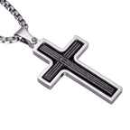 Silver cross pendant with engraved text on a white background