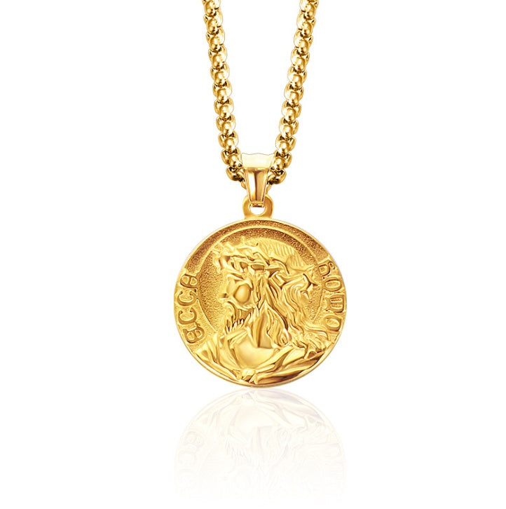 Gold necklace with a round pendant on a white background
