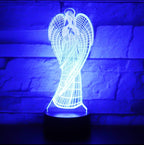 3D angel-shaped lamp glowing blue against a brick wall background