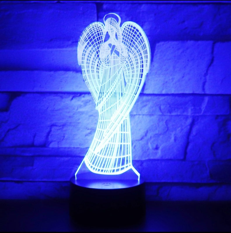3D angel-shaped lamp glowing blue against a brick wall background