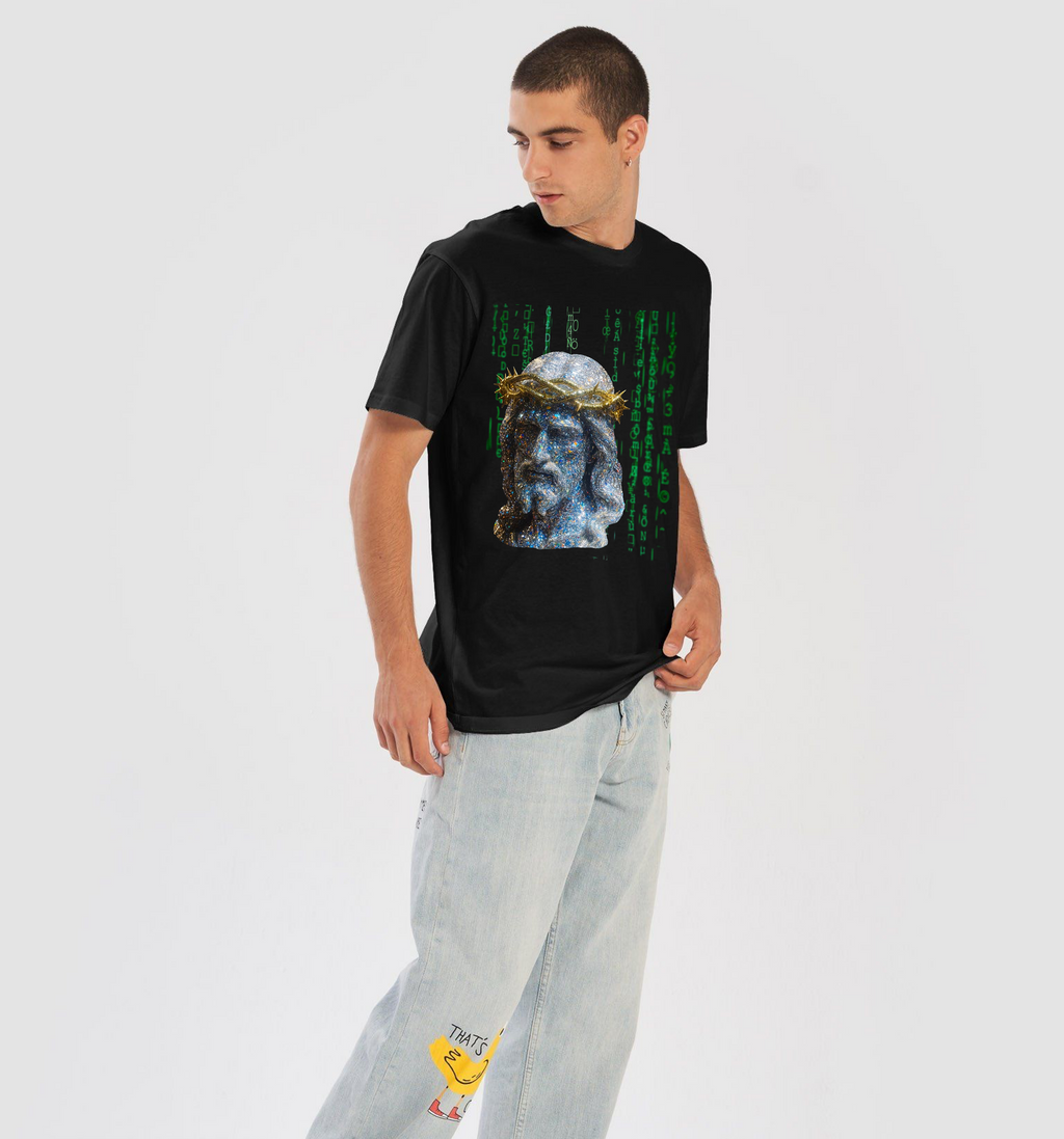 Person wearing a black t-shirt with a graphic design and light blue jeans on a white background