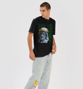 Person wearing a black t-shirt with a graphic design and light blue jeans on a white background