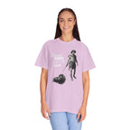 Person wearing a light purple t-shirt with graphic design and text on a white background