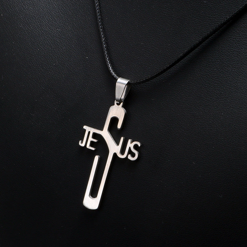 Silver cross pendant with 'Jesus' on a black background