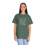 Woman wearing a green t-shirt with text on a white background