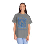 Woman wearing a gray t-shirt with a blue graphic design on a white background