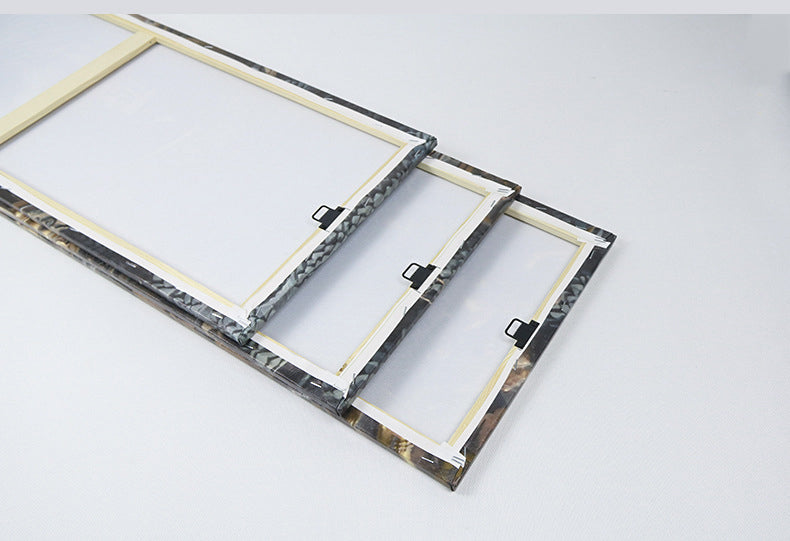 Two marble-patterned picture frames on a white background