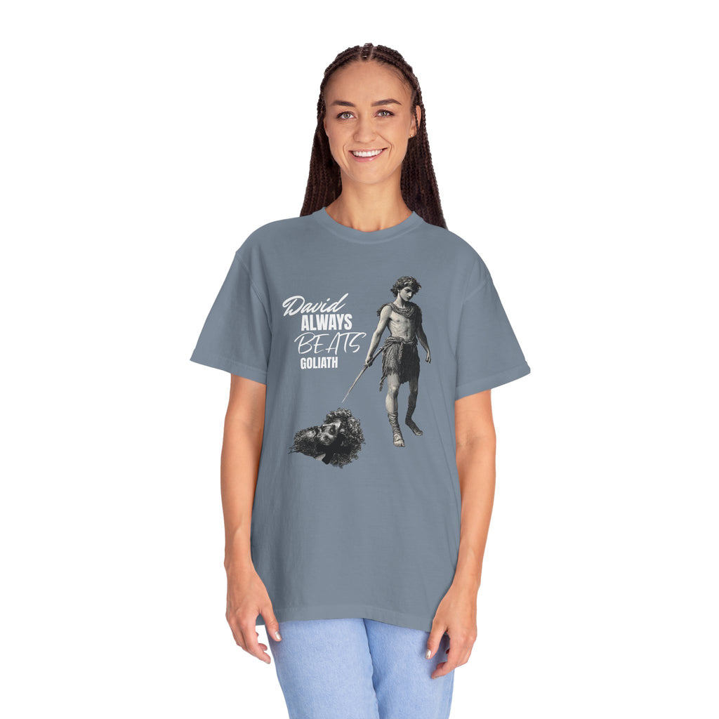 Person wearing a gray t-shirt with a graphic design and text on a white background