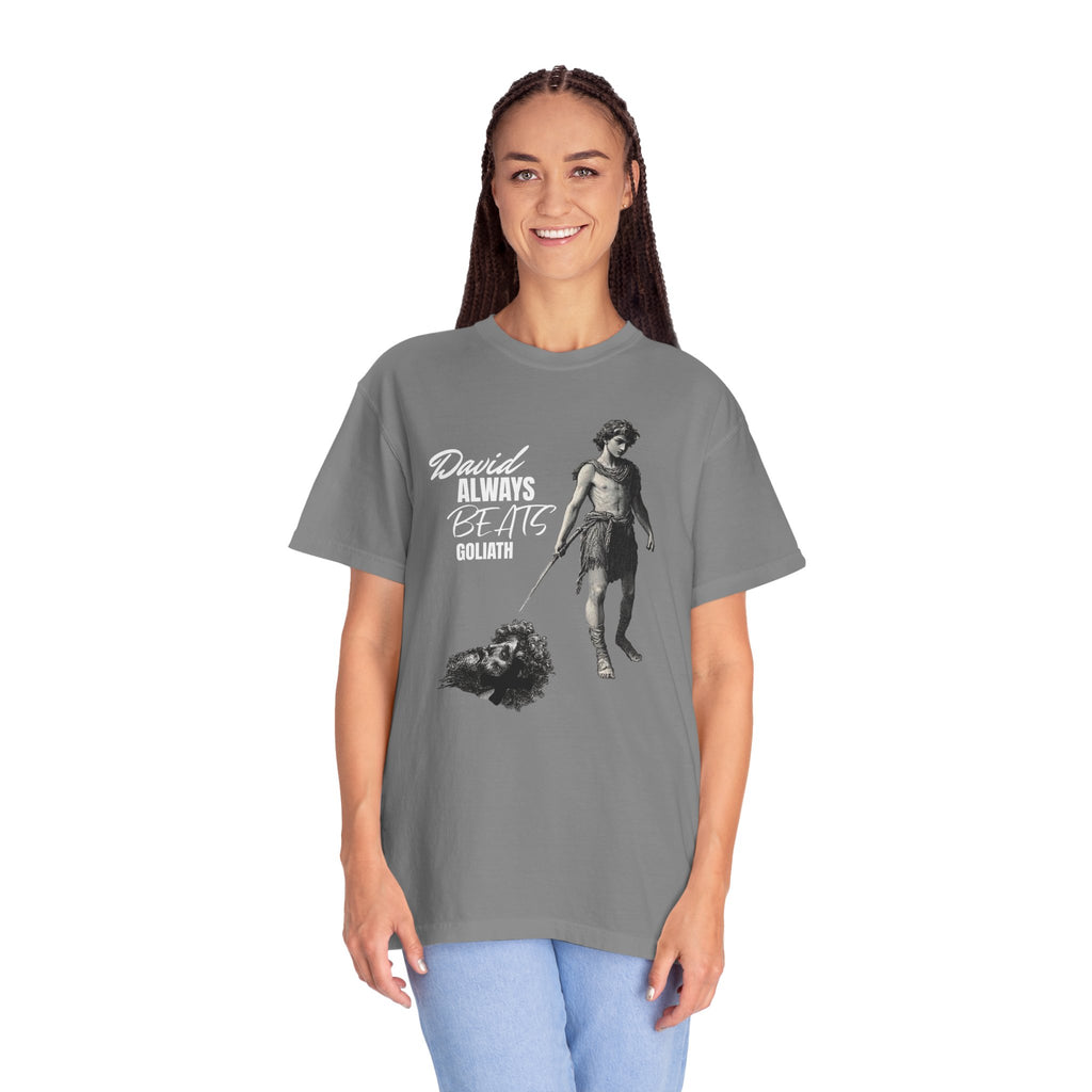 Woman wearing a gray t-shirt with a graphic design and text on a white background