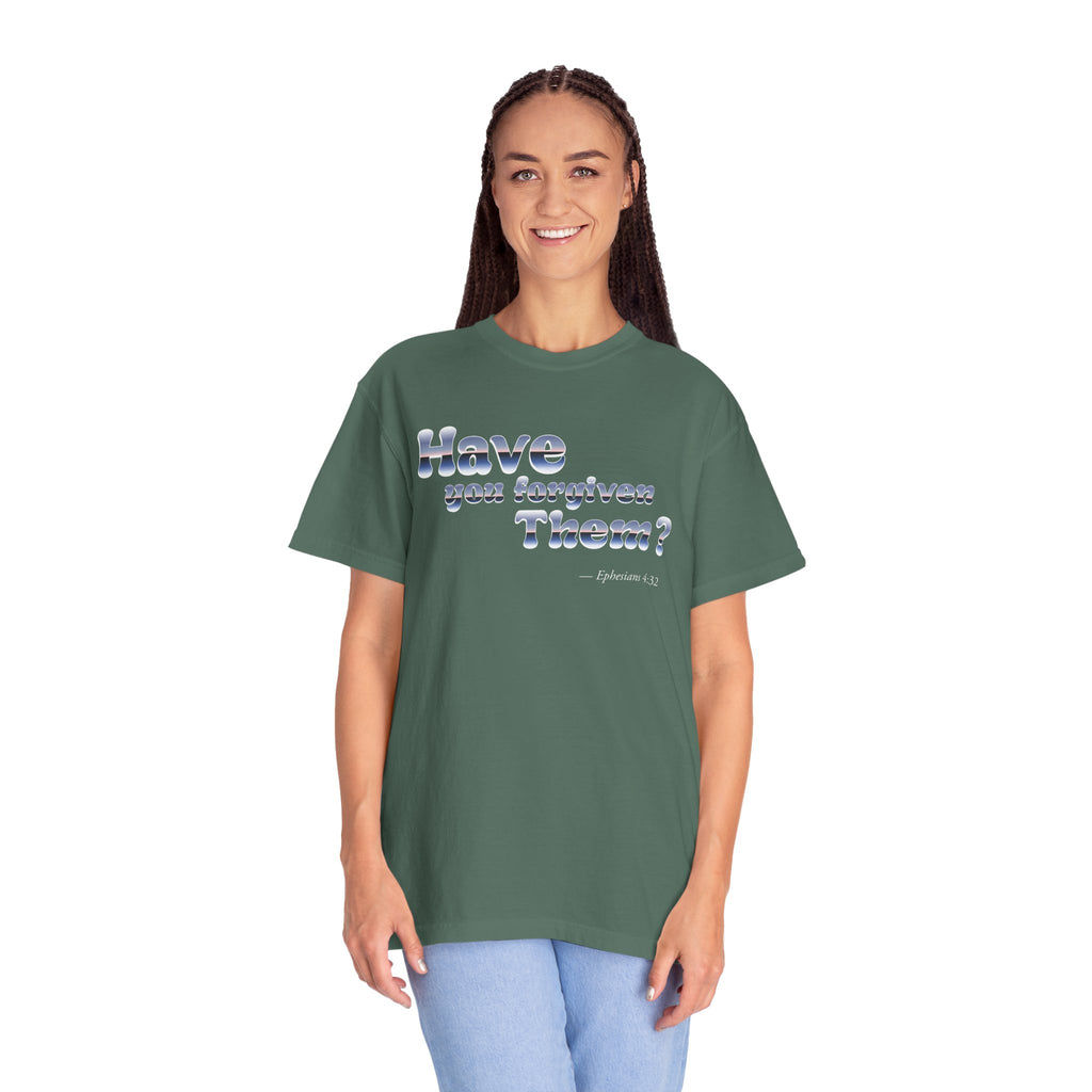Person wearing a green t-shirt with text on a white background