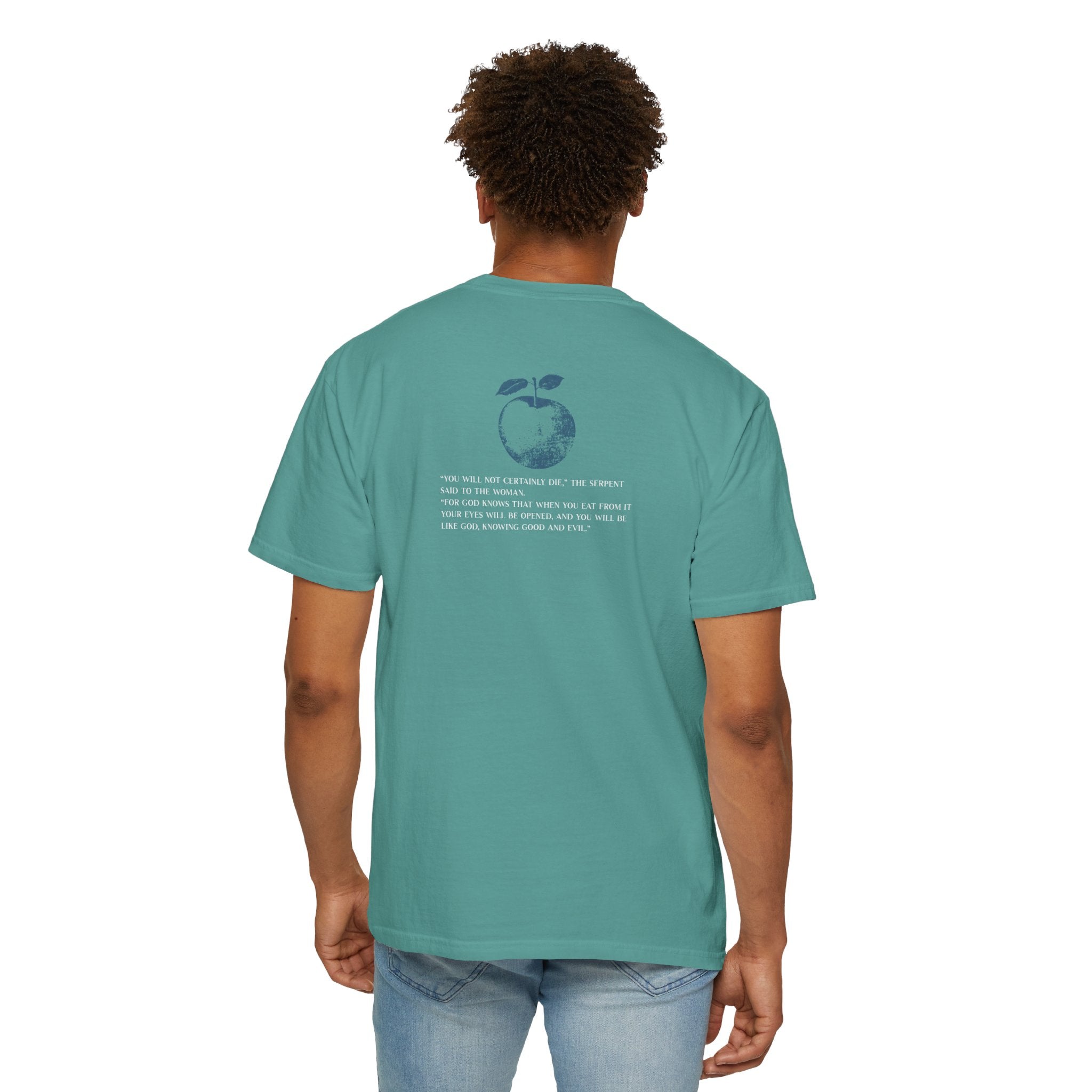 Person wearing a teal t-shirt with text on the back, standing against a white background