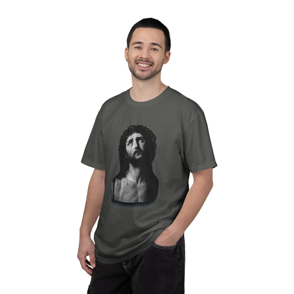 Man wearing a gray t-shirt with a graphic design on a white background