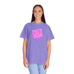 Woman wearing a purple t-shirt with 'Faith Over Mode' text on a white background