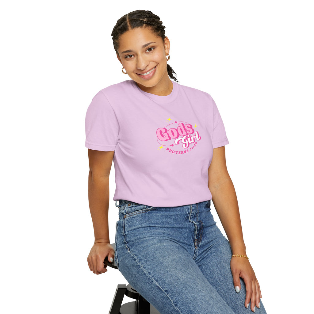 Person wearing a pink t-shirt with text and blue jeans on a white background