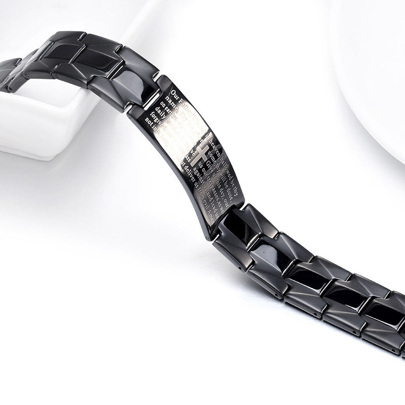 Close-up of a black ceramic watch band on a white background