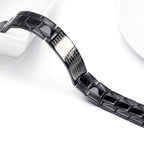 Close-up of a black ceramic watch band on a white background