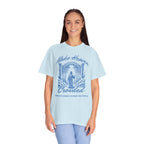 Woman wearing a light blue t-shirt with a graphic design and text on a white background