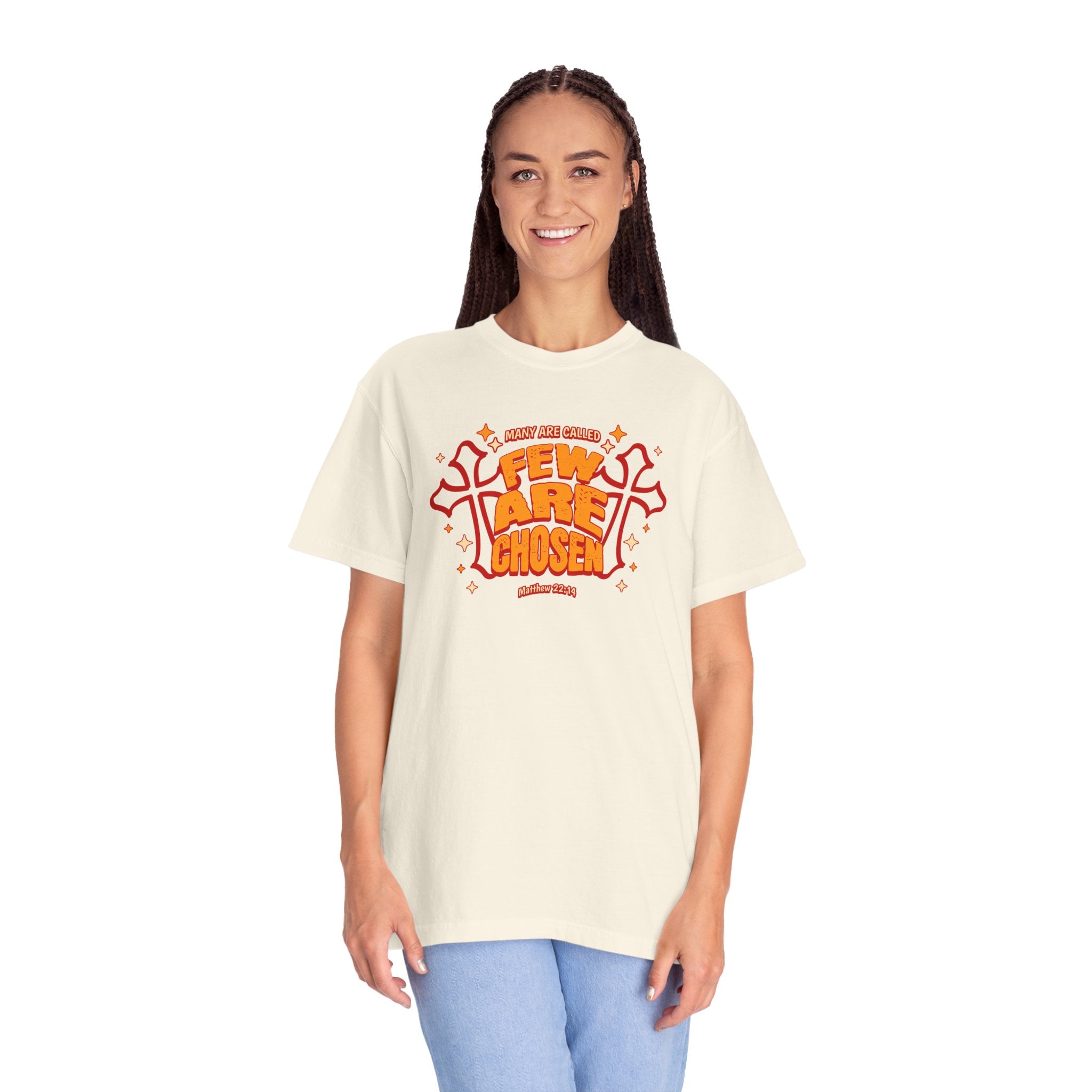 Person wearing a cream t-shirt with a colorful graphic design on a white background