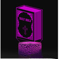 Purple LED night light shaped like a Bible with a cross on a black background