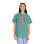 Person wearing a teal t-shirt with 'Faith over Fear' design on a white background