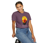 Person wearing a purple t-shirt with a graphic design on a white background