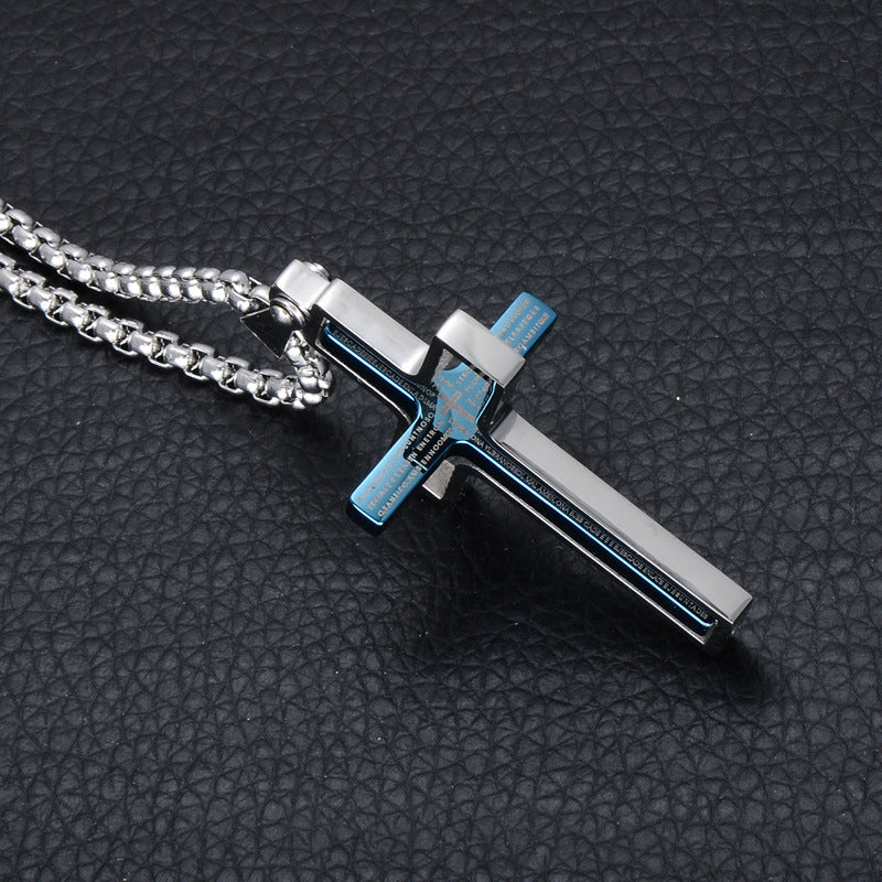 Metallic cross pendant on a chain against a dark textured background