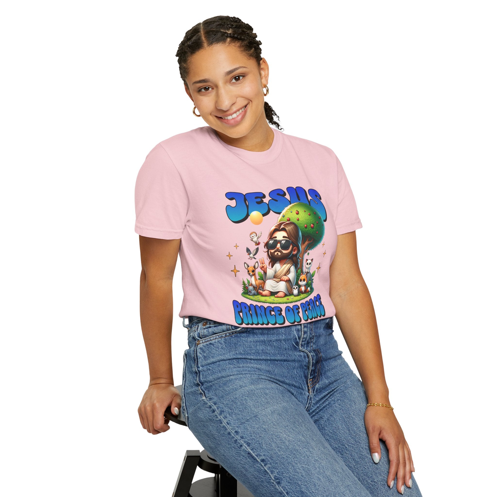 Person wearing a pink t-shirt with a colorful graphic design on a white background