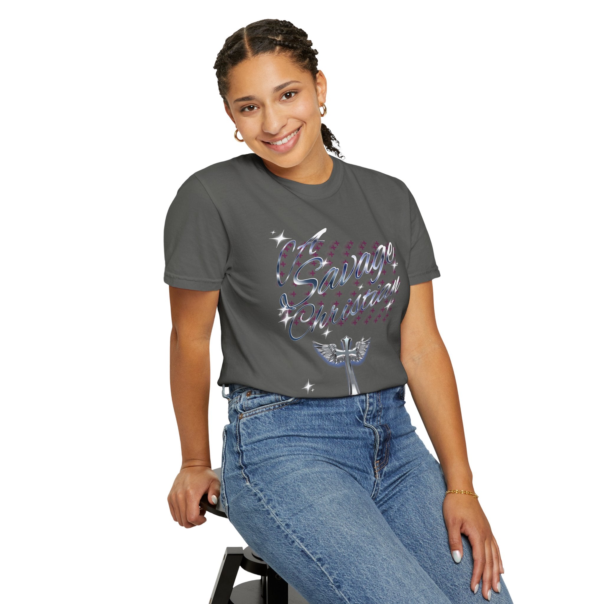 Woman wearing a gray t-shirt with colorful text and blue jeans on a white background