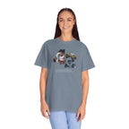 Woman wearing a gray t-shirt with a graphic design on a white background