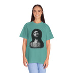 Person wearing a teal t-shirt with a graphic design on a white background