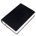 Black notebook with a visible brand logo on a white background