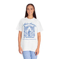 Woman wearing a white t-shirt with a blue graphic and text on a white background