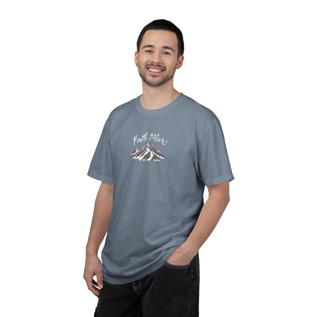 Man wearing a gray t-shirt with a graphic design on a white background