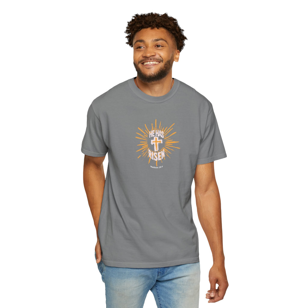 Man wearing a gray t-shirt with a graphic design on a white background