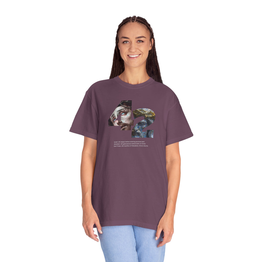 Woman wearing a purple t-shirt with colorful text design on a white background
