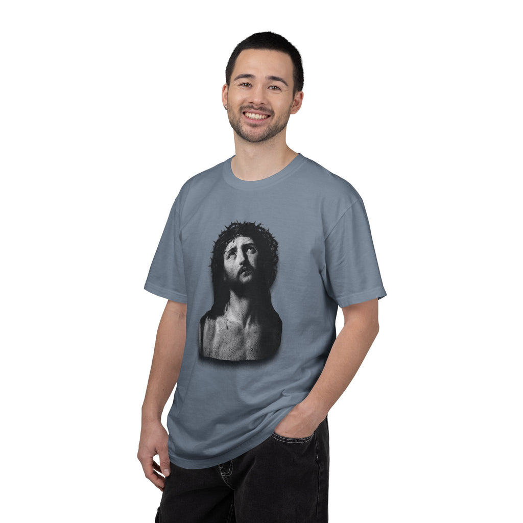 Man wearing a gray t-shirt with a graphic design on a white background