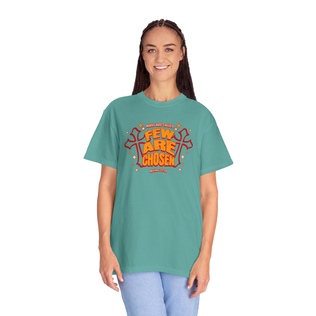 Person wearing a teal t-shirt with orange and white text on a white background